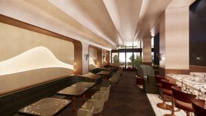 a restaurant with a row of tables and chairs at The Rhyland in Flushing +11 photos