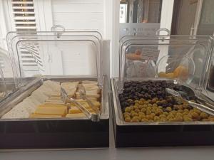 two plastic containers of cheese and other food items at Araz White House in Burgaz