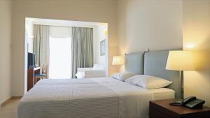 Postel nebo postele na pokoji v ubytování Hotel Saron
