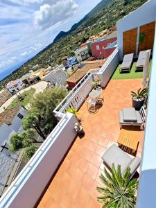 Ein Balkon oder eine Terrasse in der Unterkunft La Casita del Arco Ático