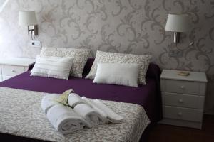 Postel nebo postele na pokoji v ubytování Hotel Herreros