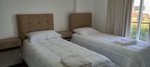 En eller flere senge i et værelse på Veneto Village