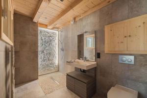 a bathroom with a sink and a toilet and a window at Au Soleil Couchant in Foncine-le-Haut +24 photos