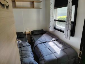Postel nebo postele na pokoji v ubytování Mobilhome La Réserve - 3 ch - 6 pers - Terrasse