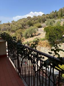 a balcony with a view of a mountain at Heliomar Naxos - Your Balcony on the Sea in Giardini Naxos