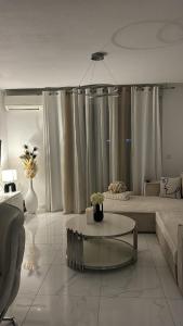 a living room with a couch and a coffee table at Appartement luxury in Montpellier +1 photo