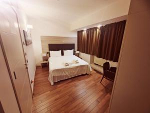 Postel nebo postele na pokoji v ubytování Hotel Nuvola