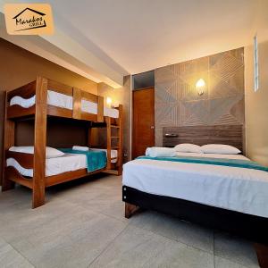 a bedroom with two bunk beds in a room at Marakos Pimentel in Pimentel +16 photos