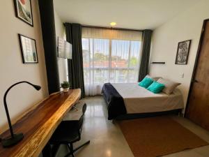 Postel nebo postele na pokoji v ubytování Baum Loft San Fernando 402