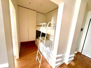 a small room with a bunk bed in it at Luxury apartment - parking, pool and beach access in Vlorë