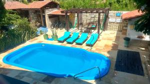 Bazén v ubytování Pousada Casa Do Angelo nebo v jeho okolí