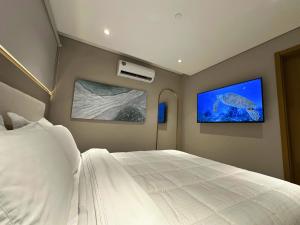 Llit o llits en una habitació de ABIBA Apart-Hotel & SPA