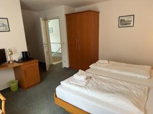 Postel nebo postele na pokoji v ubytování Stoertebeker-6