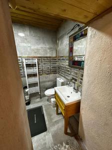 a bathroom with a sink and a toilet at Silenos Stone House Sille Antiq City in Sille