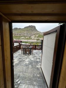 a view of a patio from a window of a house at Silenos Stone House Sille Antiq City in Sille