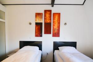 Postel nebo postele na pokoji v ubytování Hotel Bienvenue