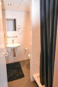 Koupelna v ubytování Hotel Bienvenue