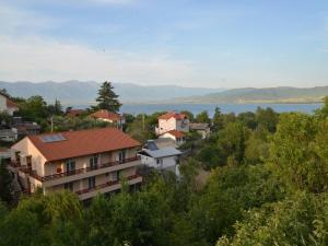 a town with a lake in the background at Vila Stefani in Star Dojran