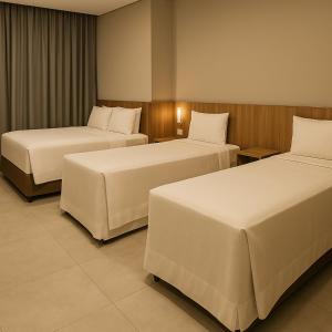 Postel nebo postele na pokoji v ubytování Hotel Solar Paulista