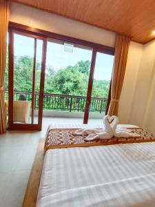 D'JERO HomeStay客房内的一张或多张床位