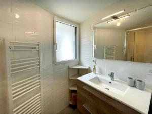 a bathroom with a sink and a mirror at Maison rénovée, loft artiste, Brem Sur Mer, 3 pers, WIFI - FR-1-231-336 in Brétignolles-sur-Mer +16 photos