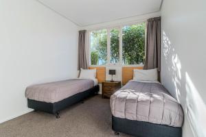 Voodi või voodid majutusasutuse George Street Motel Apartments toas