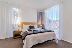 Voodi või voodid majutusasutuse George Street Motel Apartments toas
