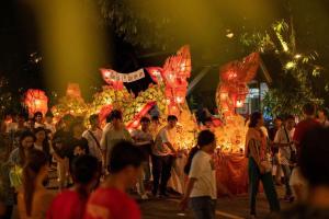 a crowd of people standing in front of a fair at Luang Prabang Golden Lotus Villa River View in Luang Prabang