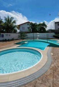 a large pool with blue water in a yard at Cozy 1-Br Home-Away-from-Home in Lapu Lapu City