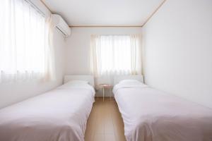 Letto o letti in una camera di 桜の旅