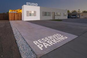 a sign that readsreserved parking in front of a building at Cactus Cottage in Yuma