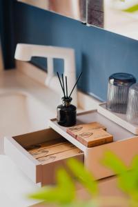 a table with two boxes and a potted plant on it at 一千零一夜喀什古城民宿 Kashgar Ancient City Scenic Area in Kashgar