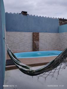 Swimmingpoolen hos eller tæt på Quintal da Ane Caraguatatuba