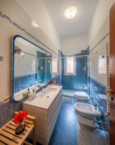 a bathroom with a tub and a toilet and a sink at Villa Yasmine in Cinisi +30 photos