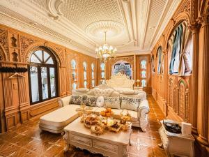 a living room with a couch and a table at 一千零一夜喀什古城民宿 Kashgar Ancient City Scenic Area in Kashgar
