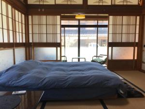 Postel nebo postele na pokoji v ubytování 農家民宿ミライサト 1日1組限定 1名から7名まで