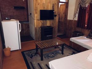 TV o dispositivi per l'intrattenimento presso Manu Villa, Manali - independent luxury villas for family