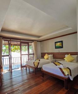 Postel nebo postele na pokoji v ubytování DG ROYAL Resort + 7 fotografií