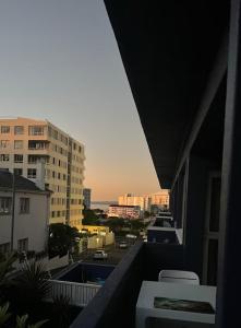 a view of a city from a balcony at Cape Town Apartment, Sea View in Cape Town +2 photos