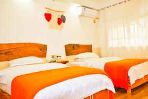 Кровать или кровати в номере Xiangzixi Bed and Breakfast