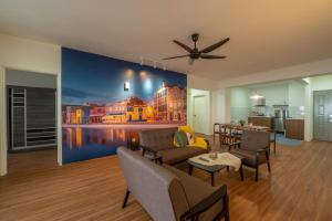 a living room with a painting on the wall at Happy Stay Golden Hills Genting in Genting Highlands