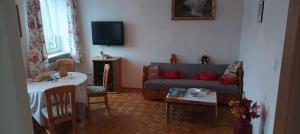 a living room with a couch and a table at Apartment Helga in Neulengbach