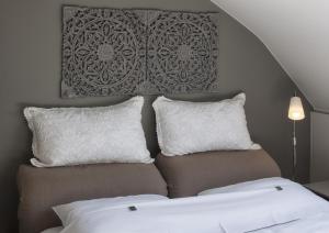Postel nebo postele na pokoji v ubytování B&B Au Grenier