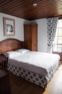 Postel nebo postele na pokoji v ubytování Hôtel de Gruyères