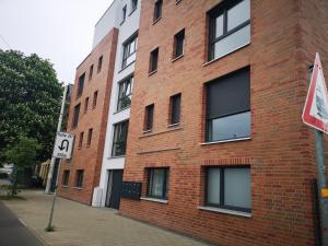 a brick building with a no parking sign next to it at Living Home in Braunschweig