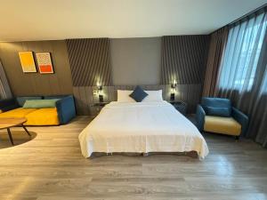 Postel nebo postele na pokoji v ubytování Hualien Pink Corner Hotel