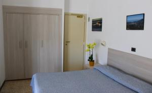 Postel nebo postele na pokoji v ubytování Hotel Puccinelli