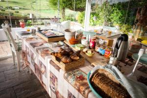 a table with food on top of it at Finca Amorosa in Villanueva de la Concepción
