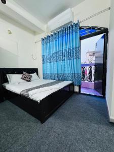 Postel nebo postele na pokoji v ubytování Hotel Ebraj Sylhet