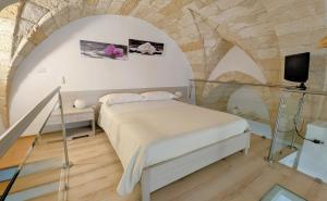 Postel nebo postele na pokoji v ubytování B&B Corte Regina Esther + 37 fotografií